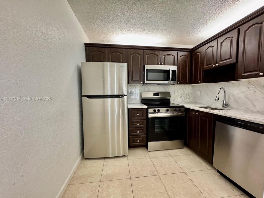 This cozy 2 bedroom/ 2 bathroom apartment is located on the second floor. The unit has tile floors throughout, open concept with dining/living area. Kitchen comes with marble countertop, garbage disposal, stainless steel appliances and stackable washer/dryer. Includes one assigned parking. It’s close to the pool and  conveniently located minutes away from shops, supermarkets, banks.