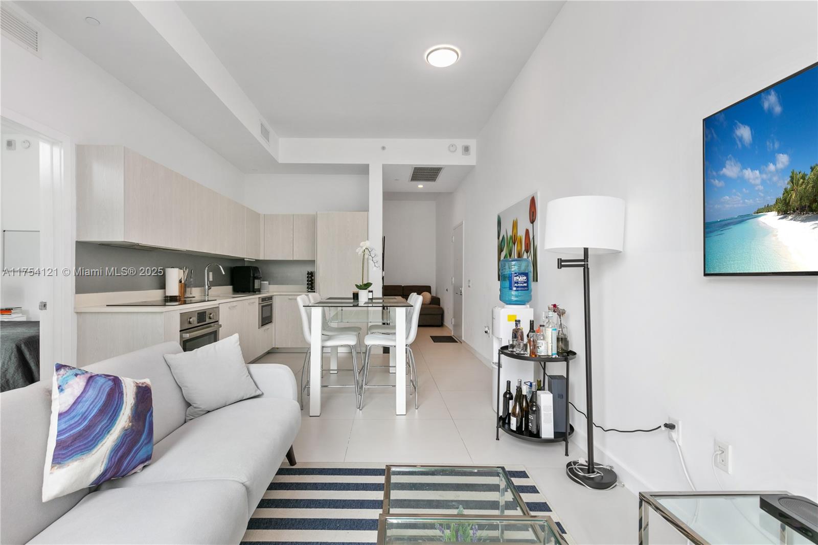 Enjoy this beautiful fully furnished 2 bedroom + Den & 2 bathroom, luxurious finishes, tile floor and top of the line open kitchen. Centrally located closed to Midtown, Design Distric, Brickell, Downtown and Miami Beach. With world class amenities, rooftop pool, 24 hours front desk, security, club room, kids room, sauna, theater, fitness center, tennis court, valet parking and much more. Valet parking on site. 1 assigned parking space.