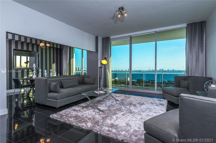 Contemporary meets elegance; this unit truly has it ALL! Boasting 1,753 square feet, this high-floor corner unit features 10 foot ceilings with almost 360 degrees of unobstructed water views! Water Views from EVERY room, including bathrooms! Unit 1502's appeal will not cease to captivate the most particular residents and guests alike. An open and spacious floor plan allows for entertaining, while the massive wraparound balcony captures more than degrees of water. The open and modern kitchen provides plenty of storage, GE profile appliances, water views, & casual dining at the breakfast bar. The Den currently serves as a formal dining and entertainment area, but may be closed off for a third bedroom w/balcony. Move-in Ready! One word describes this unit: IMMACULATE! Furniture is negotiable