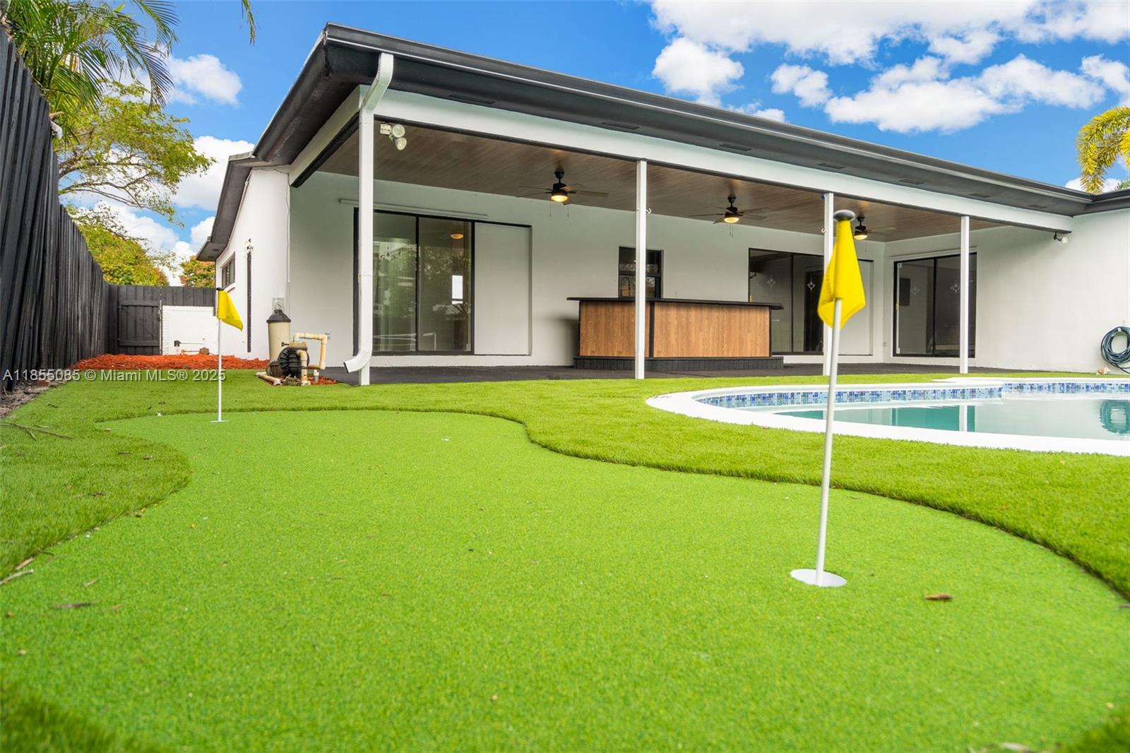 PRICED WELL BELOW APPRAISED VALUE! Own your very own private sports complex home located in the prestigious Hollywood Hills area. 15 minutes from Hollywood Beach, FLL airport, and the Hardrock Casino. This spacious remodeled 4/3 home sits on a 9,320 sq ft lot, designed for comfortable living with a floor plan that flows seamlessly. The expansive backyard boasts a sparkling pool, covered terrace, built in bar, mini golf area, pickleball court and basketball court. Perfect for outdoor entertainment and relaxation, complete with hurricane impact windows, natural lighting, modern kitchen and freshly painted exterior/interior. This home is nestled in a quiet neighborhood and is ideal for families to live in or investors seeking a second home. Don't miss your chance at making this your home.