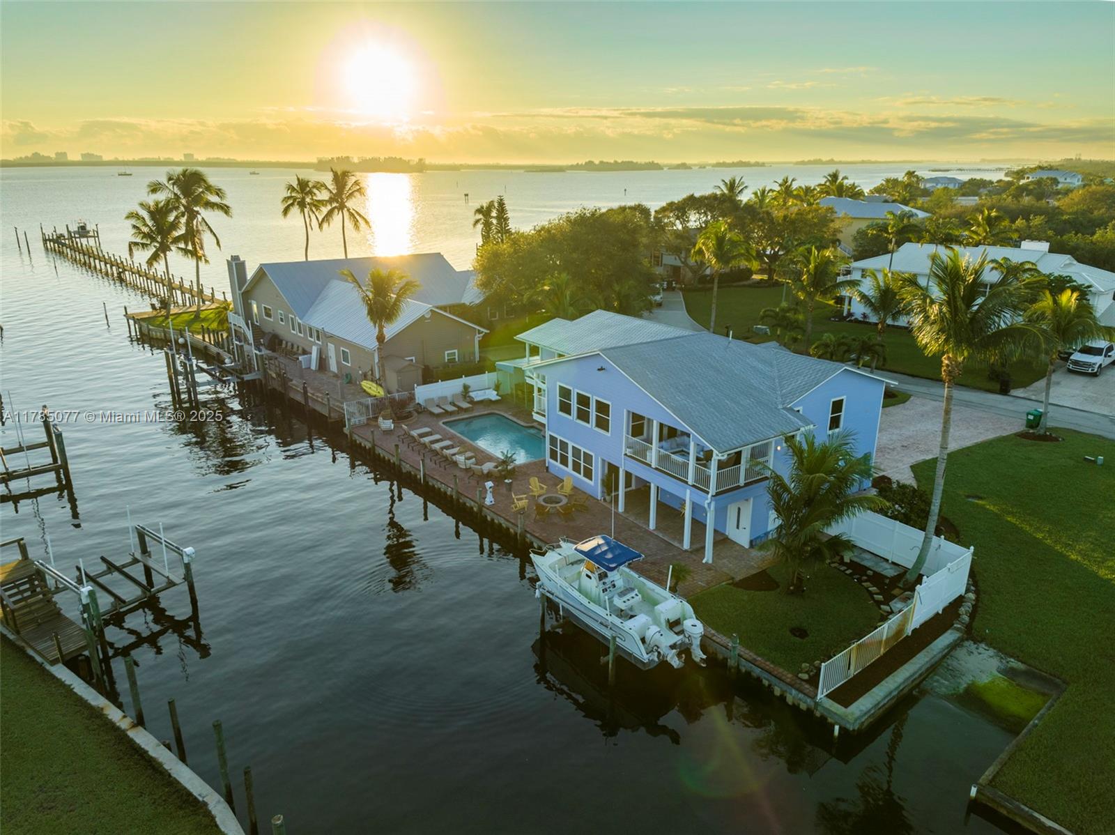 Hidden Gem in Fort Pierce! This unique Key West-style home with 6 bedrooms and 4.5 bathrooms offers stunning water views, incredible sunrises and sunsets, and a tranquil, peaceful atmosphere. Perfect for boating, with no fixed bridges and ocean access just 5 minutes away.
The beautifully renovated home features artistic concrete floors, Hardie-Plank exterior, impact windows, metal roof, saltwater pool, boat lift, retaining wall, elevated cabana, outdoor bathroom, lift, and guest suite.