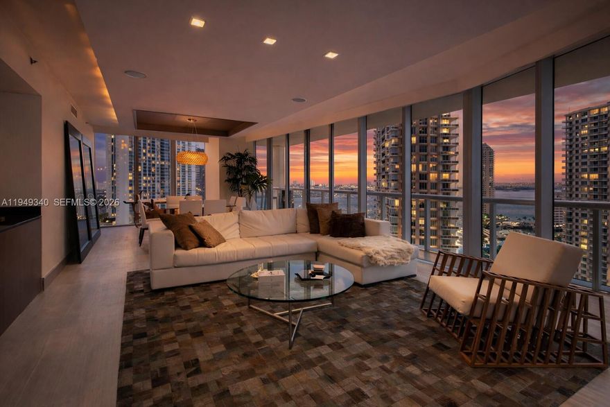Enjoy panoramic bay and ocean views from this refined residence in the center of Brickell. The primary suite opens to an expansive balcony through floor-to-ceiling glass doors and includes double walk-in closets with custom shelving. The spa-style bathroom offers a separate tub, shower, bidet, and dual sinks. Each secondary bedroom features its own bathroom and impressive water views. The European-inspired kitchen includes stainless steel appliances and generous storage. Residents enjoy resort-style amenities and immediate access to parks, dining, and shopping, with beaches just minutes away. Short-term seller financing available with flexible terms.