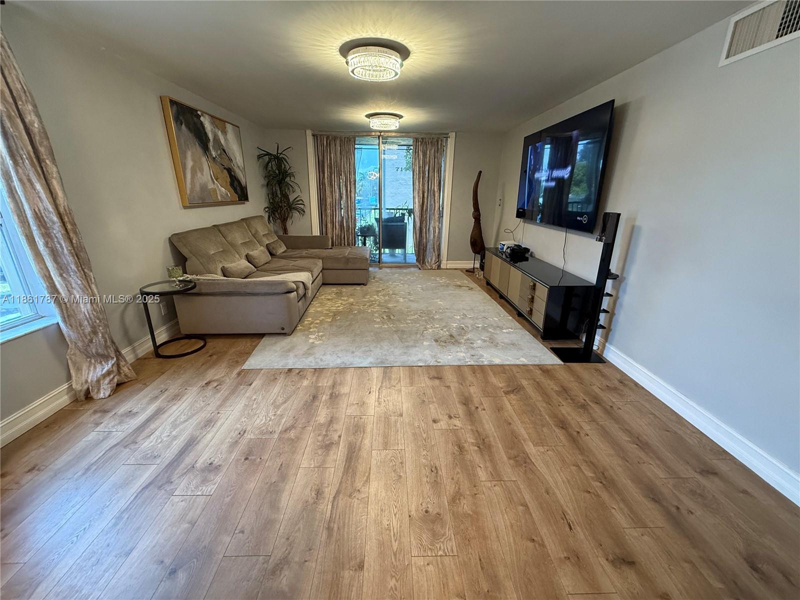 Step into this spacious corner unit, perfectly situated in the highly desirable Country Pines community. This modern condo features stunning grey vinyl flooring throughout, a brand-new A/C & heating system, and a full-size washer & dryer. Kitchen boasts all SS appliances and white shaker cabinets. The primary suite boasts a private en-suite bathroom, while both secondary bedrooms comfortably fit queen-sized beds and offer generous closet space. Enjoy indoor-outdoor living with a large, screened-in private balcony, ideal for morning coffee or evening relaxation. Assigned parking included. Community amenities include a refreshing pool, tennis courts, and a dog park. Move-in ready—don’t miss this incredible opportunity. 50yr inspection and reserves.
