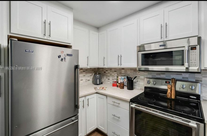 Step into this spacious corner unit, perfectly situated in the highly desirable Country Pines community. This modern condo features stunning grey vinyl flooring throughout, a brand-new A/C & heating system, and a full-size washer & dryer. Kitchen boasts all SS appliances and white shaker cabinets. The primary suite boasts a private en-suite bathroom, while both secondary bedrooms comfortably fit queen-sized beds and offer generous closet space. Enjoy indoor-outdoor living with a large, screened-in private balcony, ideal for morning coffee or evening relaxation. Assigned parking included. Community amenities include a refreshing pool, tennis courts, and a dog park. Move-in ready—don’t miss this incredible opportunity. 50yr inspection and reserves.