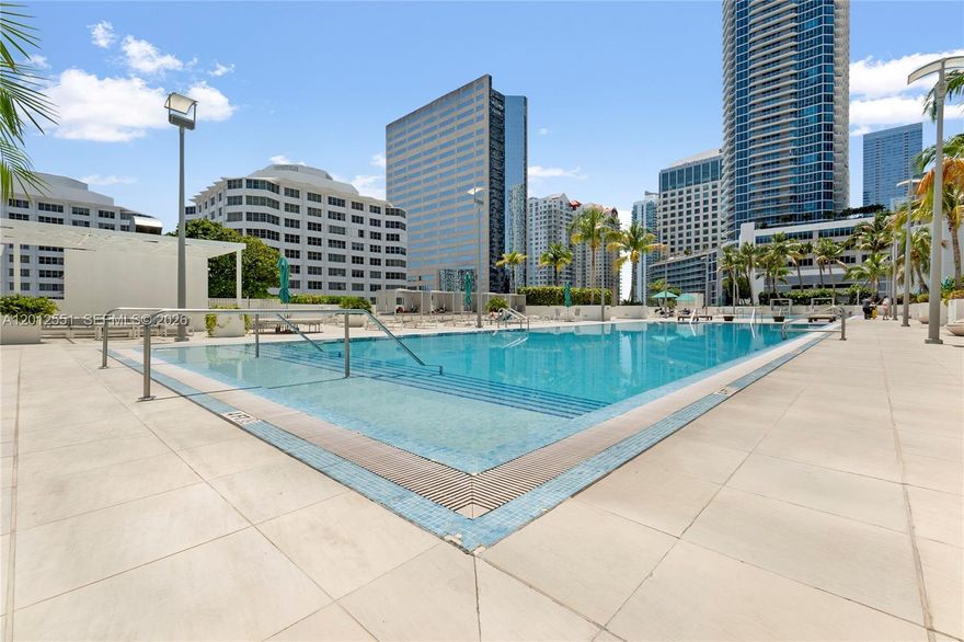 Beautiful corner residence in the heart of Brickell offering expansive city views of glamorous Brickell Avenue and abundant natural light. This spacious unit features a well-designed split floor plan, floor-to-ceiling impact windows, and a private balcony ideal for enjoying Miami’s vibrant skyline. The open kitchen is equipped with modern cabinetry, granite countertops, and stainless steel appliances, flowing seamlessly into the living and dining areas—perfect for both everyday living and entertaining.
The primary suite includes a generous walk-in closet and an en-suite bathroom with dual sinks, soaking tub, and separate shower. Additional highlights include in-unit washer and dryer and ample storage throughout. Located in a full-service building with resort-style amenities including pool, fitness center, club room, and 24-hour concierge. Prime Brickell location just steps from top dining, shopping, and entertainment, with easy access to major highways.