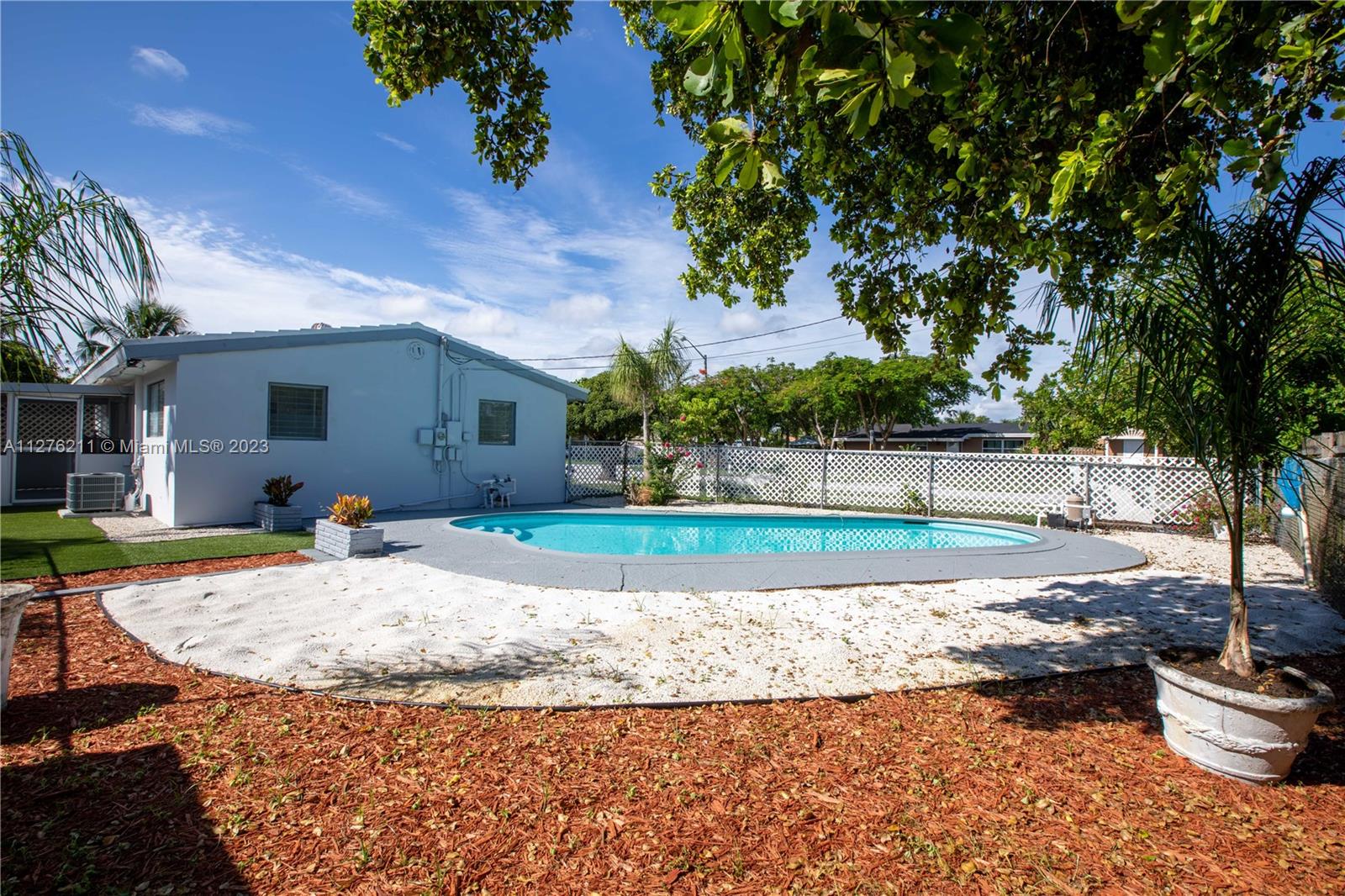 Adjusted for 3 bedrooms, 2 baths single family home with a resort style pool. This home features granite countertops, white kitchen cabinetry, brand new appliances, modern bathrooms, wood style flooring throughout the house. Covered lanai and an exuberant backyard sitting on almost 8000 sq feet corner lot with enough space to park a large size boat or RV. New AC with 10-year warranty. Water heater 2 years old, 1 year warranty for the kitchen appliances. No HOA fees. FHA and VA eligible. Comes with a large size shed. Pompano Community Park offers tennis courts and an amphitheater. Approximately 3 to 5 miles away from the beach, Golf course, Marina, and 7 miles away from Boca Raton.