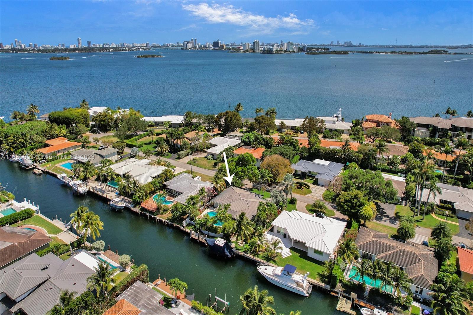 Beautiful rare waterfront home in a prime location, in peaceful and charming Miami Shores! This home is a boater's paradise with direct ocean access, 85 ft. on the water with a boat lift & 2 car garage. Home has very large 3 bedrooms and 4 full baths. Features an open layout with a formal living room, dining room, family room and a large kitchen. The entire home gets tons of natural light, surrounded by vast windows overlooking the water & pool area. Huge backyard and covered patio that's great for entertaining. This home has an updated kitchen with stainless steel appliances and modern updated bathrooms. Miami Shores has a beautiful country club with a water park and golf course. A short drive to Beaches & shopping, grocery store and restaurants.