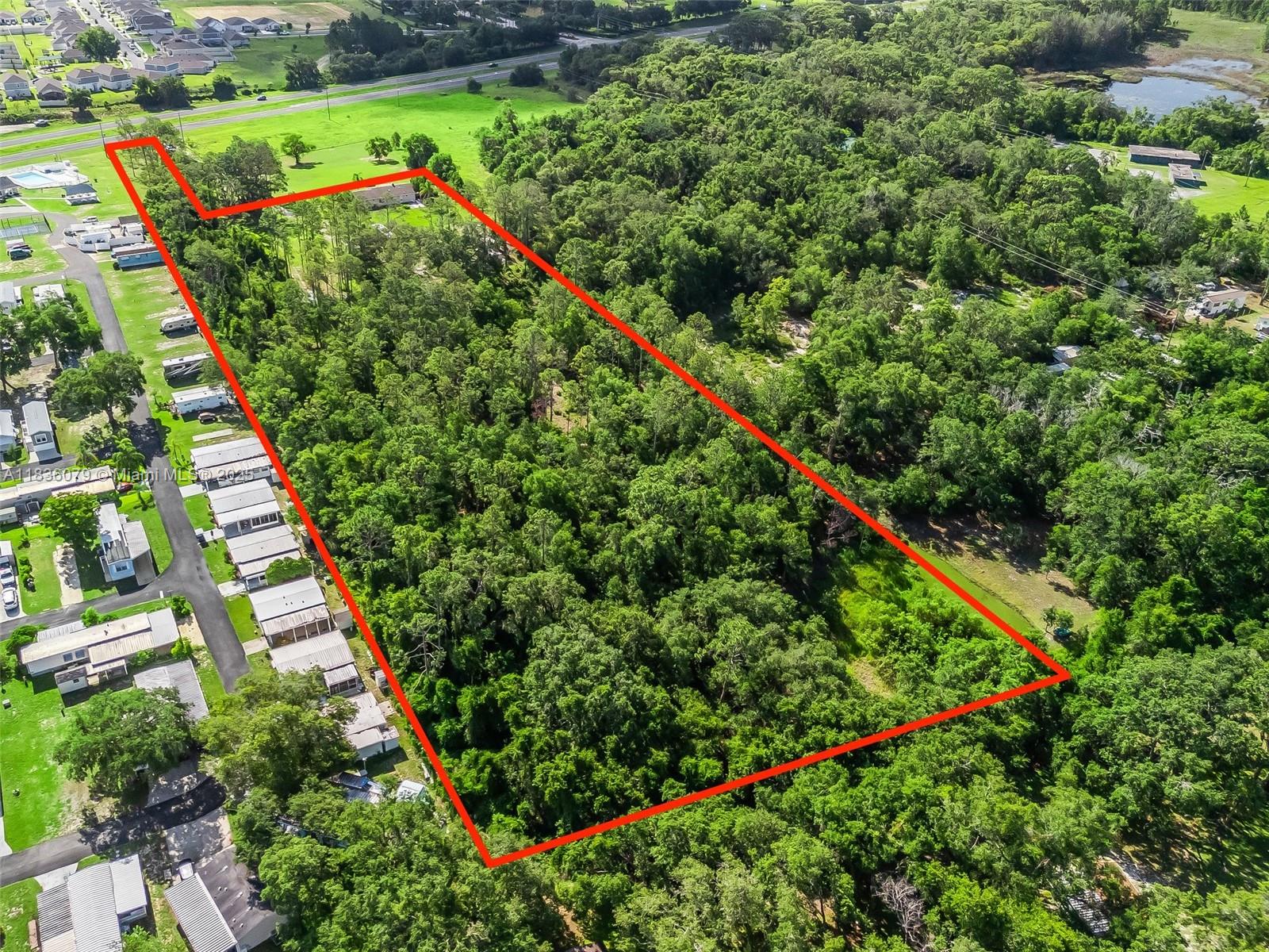 Incredible opportunity to own 7 acres of high-exposure commercial land directly on US Highway 27 in Leesburg, Florida. With excellent frontage along a major thoroughfare, this property offers unmatched visibility and accessibility—ideal for retail, office, industrial, or mixed-use development. Located in a rapidly growing corridor surrounded by national retailers, medical facilities, and residential communities, this site is well-positioned for future growth and investment. Whether you're a developer or investor, this is a rare chance to secure a sizable commercial tract in one of Central Florida’s most active markets. Utilities available nearby. Zoning allows for a wide range of commercial uses.