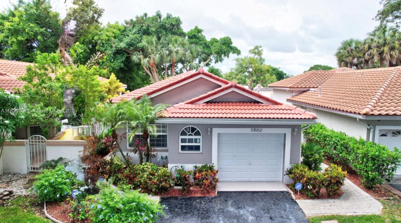 Beautifully upgraded 3BR/2BA home in Sawgrass Plantation with NEW ROOF & GUTTERS (2023). Features a smart split-bedroom layout, freshly painted inside and out, a stunning renovated kitchen with modern cabinetry, pantry, and new stainless appliances. Bathrooms have sleek tile and upscale finishes. Elegant tile and hardwood floors throughout, custom built-ins, impact windows, accordion shutters, and ADT security. Professionally landscaped with automated irrigation and lighting. Ideally located near Sawgrass Mills, I-75, I-595, and FLL Airport. A true move-in ready gem!