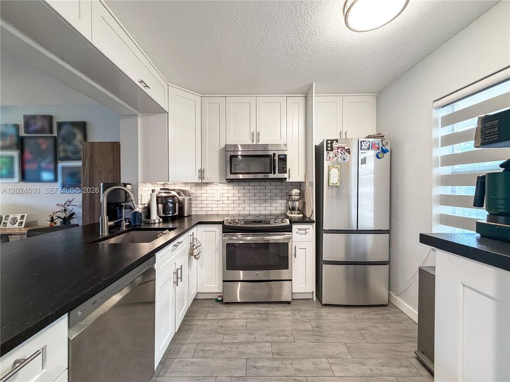 Photo of 2900 NW 42nd Ave #A207, Coconut Creek, FL 33066 (MLS # A12024530)