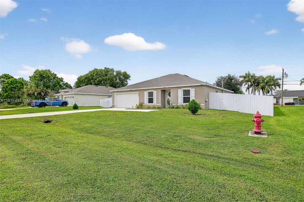 Photo of 1049 SW California Blvd, Port St Lucie, FL 34953 (MLS # A11875444)