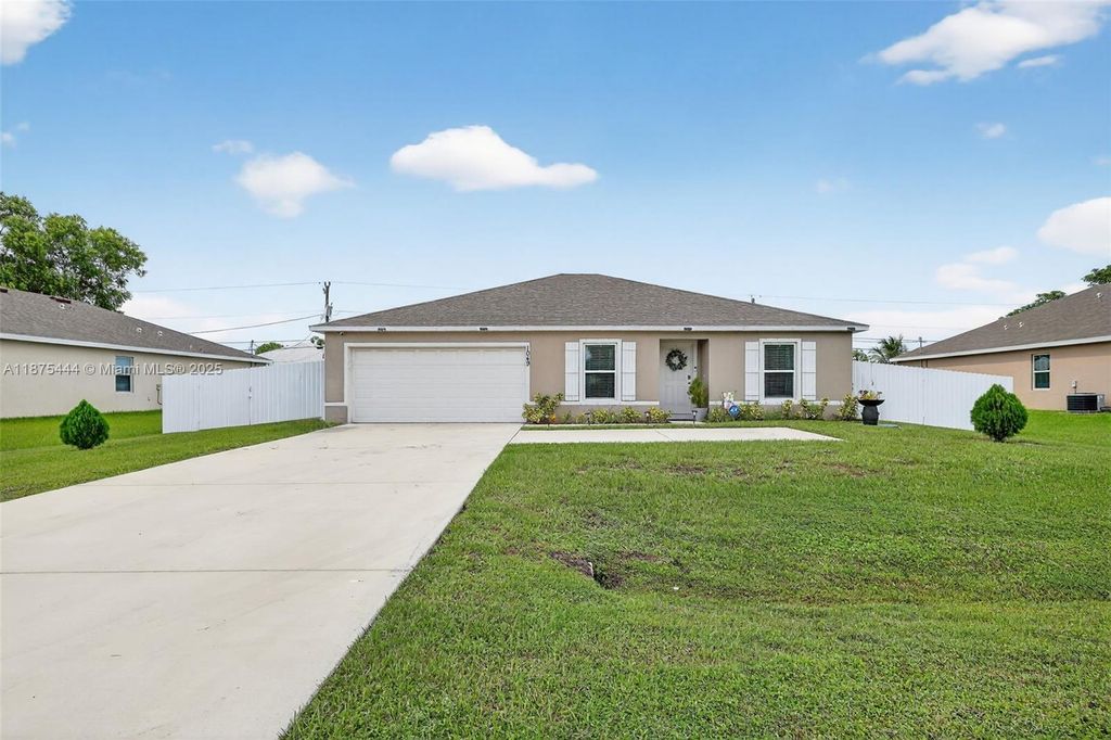Photo of 1049 SW California Blvd, Port St Lucie, FL 34953 (MLS # A11875444)