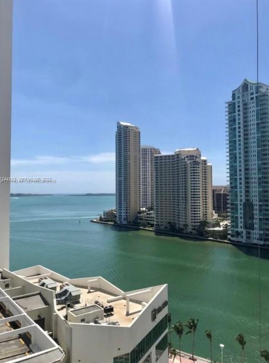 Loft-style residence with stunning bay views. This spacious 1-bedroom, 1.5-bath unit features white tile floors throughout, Italian cabinetry, granite countertops, and stainless steel appliances, including an in-unit washer and dryer. One assigned parking space.
