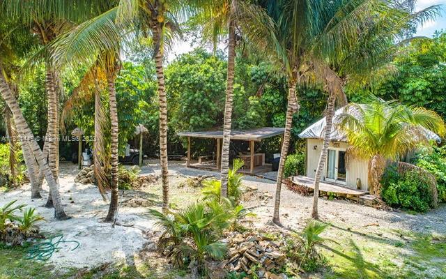 Looking for a unique opportunity to build your dream country home? Look no further! This nearly 2-acre lot is the perfect canvas for your new estate, with easy access to Florida's Turnpike and just 30 minutes from Key Largo and 20 minutes from Miami. Nestled in a secluded area, you'll enjoy the peaceful country lifestyle while still having access to new shopping and entertainment areas nearby. With enough space for a lovely multi-generational compound, this lot provides endless possibilities for creating your ideal living space. This partly cleared buildable residential lot has a path to the canal on side of the property that has already been cleared, adding to the charm and character of this stunning lot. Don't miss out on this fantastic opportunity Contact us today to schedule a showing.