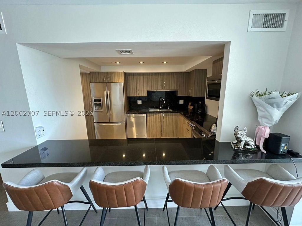 Photo of 801 Three Islands Blvd #412, Hallandale Beach, FL 33009 (MLS # A12062707)