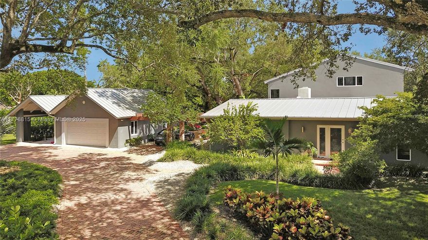 Park like setting on this 40K lot. Home includes new metal roof, impact windows and doors throughout. All new modern floors, bathrooms and kitchen. The home has an excellent layout including the second floor 1061 square foot master suite with enormous bathroom and closet. The house flows to the family room which includes a wet bar and access to the pool and outdoor areas. Home is a 4 bedroom 4.5 bathroom with formal dining/formal living room combo a large family room, laundry room. 4th bedroom first floor can be second master. The homes exterior includes a detached 2 car garage connected to a boat port can be used for boat storage or an additional outdoor covered space. Updated pool, a BBQ area and two synthetic grass playground areas with an in ground trampoline.