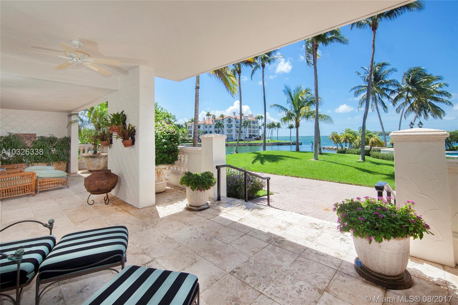 Location! Location! Location! Priced To BUY in today’s BUYER’S MARKET – Located at the coveted tip of Fisher Island with unobstructed 270-degree views to the Atlantic Ocean, Biscayne Bay, marina and city. Corner ground floor walk out to lawn, steps to pool and an expansive wraparound terrace with total privacy!!! Feels like you are living in a private residence. 3 bedrooms/3.5 baths which includes a large master suite with walk-in closet and direct terrace access, plus 2 guest room suites. Spacious open living room with fireplace and dining room both with amazing bay views, fine marble floors throughout, gourmet kitchen and a separate breakfast area. Must see to appreciate.