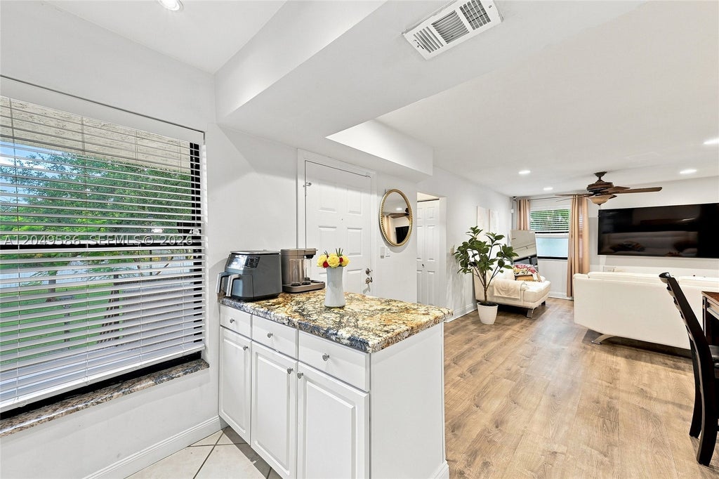 Photo of 9858 NW 3rd St #9858, Plantation, FL 33324 (MLS # A12049586)