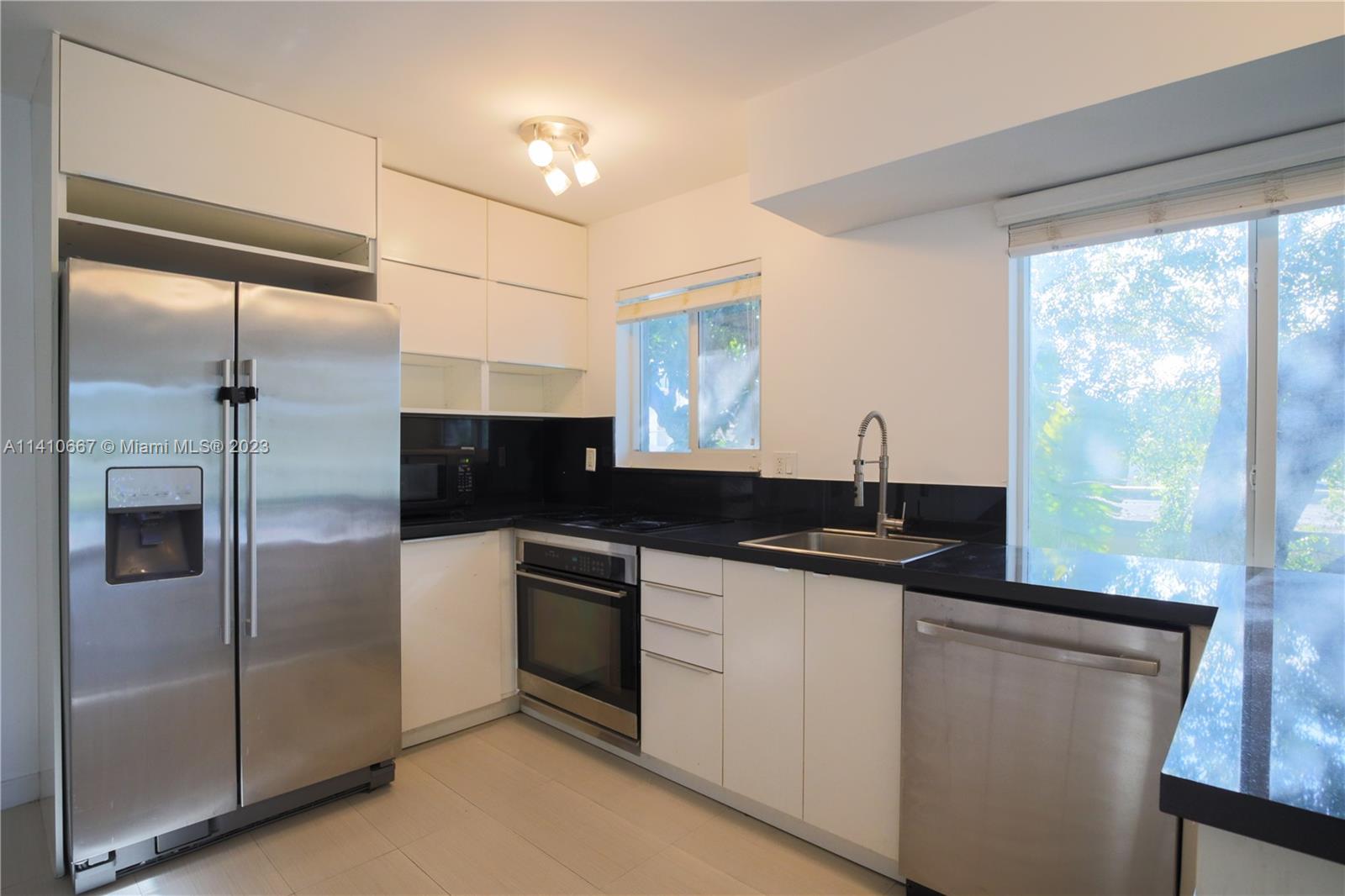 Completely updated 2 bedroom 2 story townhome located in the heart of Coconut Grove. This unit welcomes you with an open kitchen, modern tile floor, stainless steel appliances, dishwasher, garbage disposal, washer & dryer, 1/2 Bath, and spacious balcony. Enjoy the custom glass railings, custom wood stairs, and modern hanging chandelier. Both bedrooms located upstairs with balcony access each room. The fullpath separates both rooms and both closets within bedrooms offers custom california closets. Building offers hurricane impact windows & state of the art security cameras. Apartment has 1 assigned parking spot and also offers street parking for guests. Minutes away from Cocowalk, University of Miami, Coral Gables, Brickell, Sunset Mall and much more!