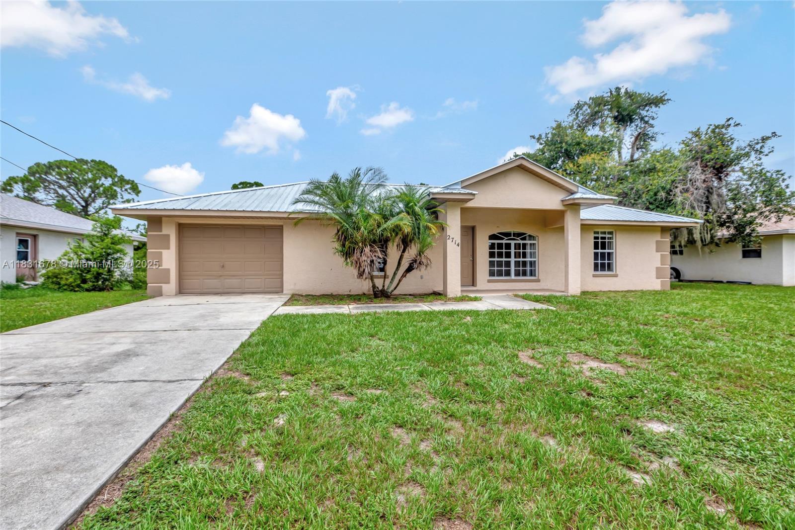 Welcome home to this charming and well-maintained 3-bedroom, 2-bath ranch-style home nestled in a friendly and walkable neighborhood. New metal roof in 2024! Ideally located near schools, shopping, and a variety of local restaurants. Step inside to a functional single-level layout featuring durable tile floors throughout, a spacious living area & a cozy dining space perfect for everyday meals or casual gatherings. The charming galley kitchen offers efficiency & style, with easy access to the dining area for seamless entertaining. Relax and unwind on the screened-in back porch overlooking the large backyard. This move-in ready gem is perfect for first-time buyers, downsizers or anyone seeking a low-maintenance lifestyle in a welcoming community. Don’t miss your chance to make it yours!