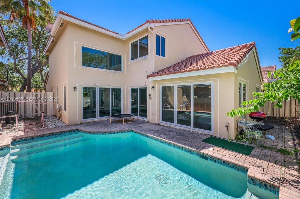 Photo of 1065 Weeping Willow Way, Hollywood, FL 33019 (MLS # A12010595)