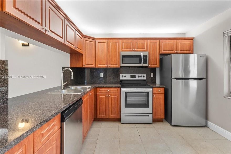 Charming 3-bedroom, 2-bath ground-floor condo ceramic floors thorough, with serene lake views. Recently remodeled kitchen and bathrooms, plus a new HVAC system. Washer and dryer inside the unit. Enjoy a private balcony, community pool access just steps away, and convenient parking at your door. Ideal as a family home or investment, can be rented immediately. Pets welcome.  Priced to sell—don’t miss this opportunity!