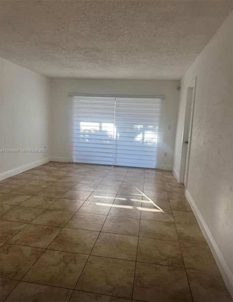 Photo of 3110 N Pine Island Rd #110, Sunrise, FL 33351 (MLS # A11968656)