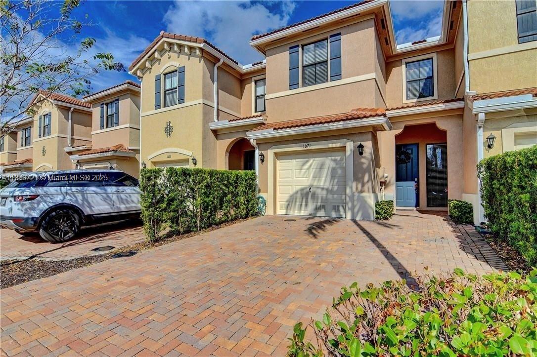 Welcome to Madison Place! This elegant 3 Bed / 2.5 Bath townhome offers modern living with impact windows & doors, smart security system, open kitchen with granite countertops & stainless steel appliances, and a private garage with double driveway. Residents enjoy a lakefront pool & lounge area in a beautifully maintained community. Ideally located—just 15 minutes from the beach and 20 minutes from Fort Lauderdale Airport with quick access to major highways.
