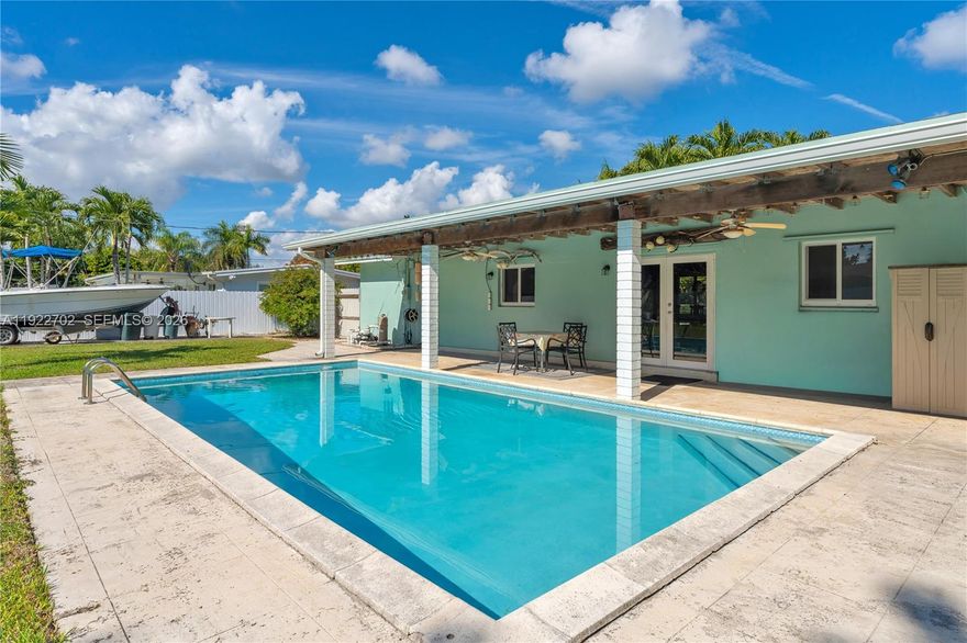 Welcome to 9340 SW 178 Street — a beautifully updated 4-bedroom pool home that blends modern comfort with true South Florida living. Set on an impressive 16,560 sq ft lot, this residence stands out from the moment you arrive with clean curb appeal, mature landscaping and a private feel that is hard to find in today’s market.
Step inside to an open floorplan filled with natural light, plantation shutters, impact windows and a large family room that creates the perfect setting for everyday living and effortless entertaining. The remodeled kitchen serves as the heart of the home with quartz countertops, solid wood cabinetry and stainless steel appliances, offering a clean, timeless design. The home features a newer roof, PVC pipes, remodeled guest bath and a thoughtful layout that maximizes space and comfort. All four bedrooms offer flexibility for family, guests, working from home or creating the ideal media or hobby space. Outdoors, the oversized yard is where the property truly shines. The 16k lot provides room for a boat, RV, future additions and still leaves plenty of green space to enjoy. Fruit trees, a sparkling pool and covered areas make this the kind of backyard families dream about — private, peaceful and built for gatherings. Located in a quiet, established neighborhood near top schools, parks, restaurants, Black Point Marina and major roadways, 9240 SW 178 Terrace offers the rare combination of space, upgrades and an unbeatable location.