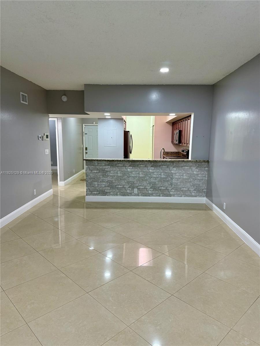 Spacious 2/2 Condo – Move-In Special! First month you only pay half.
Well-maintained 2-bedroom, 2-bath unit with 1,140 sq ft of living space and a desirable split-bedroom layout. Unit features include fully tiled flooring throughout, central A/C, in-unit washer and dryer, private balcony, and water included in rent. Move-in special: only first month and one month security deposit required – not based on full month's rent! No pets. No smoking. Unit is vacant and ready for occupancy. Schedule your showing today!