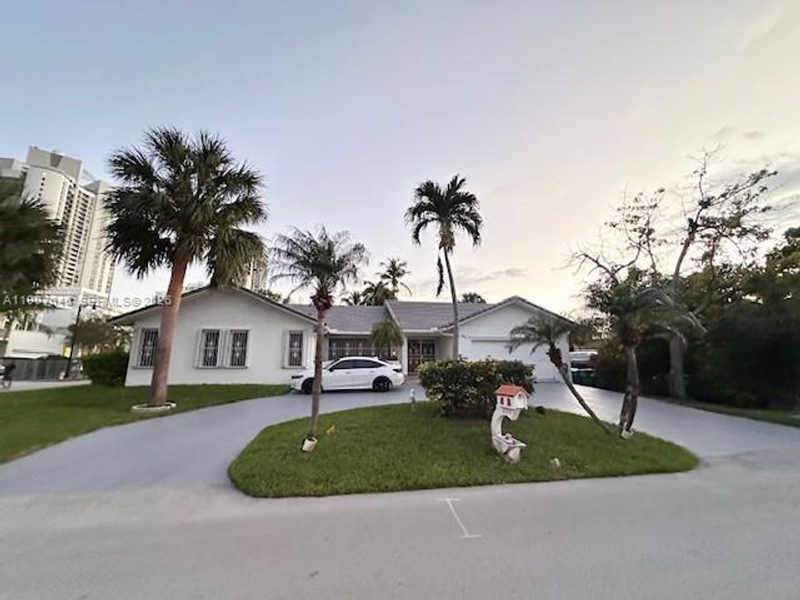 Spacious Corner Lot Home in Sunny Isles Beach. Just Steps from the Ocean! single family home offers 2,632 SqFt of living area and sits on a generous 9,254 SqFt corner lot. 4 beds/3 baths with a spacious living room, dining area, large kitchen, and a bright Florida Room. Recent updates include a brand-new roof and new pavers around the pool area, both completed just two months ago. The home also includes two air conditioning units, an outdoor shower by the pool, and a two-car garage. The circular driveway. This property offers incredible potential perfect for someone looking to remodele customize to their taste, or for developers seeking to build a new luxury home in one of the most desirable neighborhoods, where new constructions are selling at high value. The seller is highly motivated