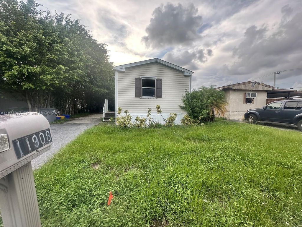 Photo of 11908 Cove Pl #B, Boca Raton, FL 33428 (MLS # A11871897)