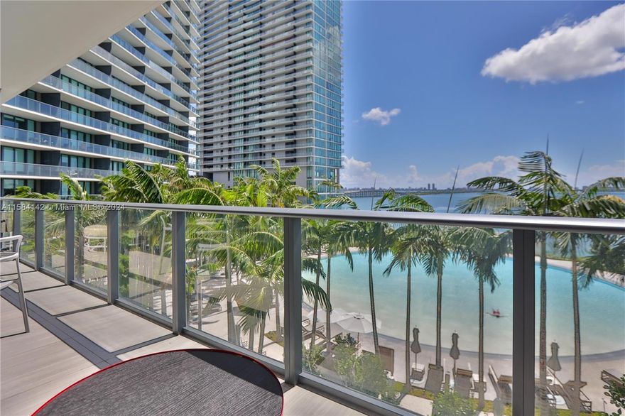 Indulge in a luxurious waterfront lifestyle at this sophisticated 2-bedroom + den, 2-bathroom residence. Its open concept kitchen with Sub-Zero / Wolf appliances and elegant Master en suite with custom drapery and floor-to-ceiling glass doors lead out to its expansive private terrace and exquisite circular sunset pool with stunning views of Biscayne Bay and Miami Beach. With interiors by Piero Lissoni, residents of Gran Paraiso enjoy world-class amenities: its 2-acre resort deck, state-of-the-art gym, and outdoor spa. With an impressive landscape by Enzo Enea and permanent museum-quality curated art installations throughout the building, it offers the perfect blend of luxury, convenience, and inspiration. Live within minutes of Wynwood, Design District, Midtown, and Miami Beach.