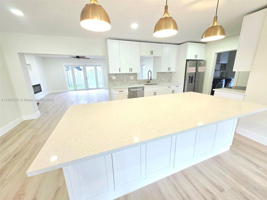 Completely Renovated and Move-in Ready 3/2 Single Family Home with No HOA!! Open Concept / Floor plan with a Wood-like Tile Floor Planks throughout the entire home - large Kitchen Island, Beautiful Pendant Lighting, Shaker Style Cabinets, Stainless Steel Appliances, Quartz Counter Tops, and Wine Cooler - Large Great Room with a Beautiful 6 Foot Recessed Fireplace and Room for a Large Wall Mount TV on Top - Beautiful and Spacious Master Suite with Walk-in Closets ($3200 Credit for Custom Closets), Small sitting room or room for a treadmill / workout space or kitchenette, Spacious Master Bath with Double Sink and a large Rainfall Shower - Covered Patio with a built-in BBQ Grill and Sink - Whole House Generator - Tankless Water heater - 3 Minutes to Pine Crest & Westminster Private Schools