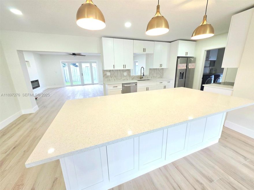 Completely Renovated With over $100k in Upgrades - 3/2 Split Bedroom Single Family Home with No HOA!! Open Concept Floor plan with a Wood-like Tile Floor Planks throughout the entire home - large Kitchen Island, Shaker Style Cabinets, Stainless Steel Appliances, Quartz Counter Tops, and Wine Cooler - Large Great Room with a Beautiful 6 Foot Recessed Fireplace and Room for a Large Wall Mount TV on Top - Beautiful and Spacious Master Suite with Walk-in Closets ($3200 Credit for Custom Closets), Small sitting room or room for a treadmill / workout space or kitchenette, Spacious Master Bath with Double Sink and a large Rainfall Shower - Covered Patio with a built-in BBQ Grill and Sink - Whole House Generator - Tankless Water heater - 3 Minutes to Pine Crest & Westminster Private Schools