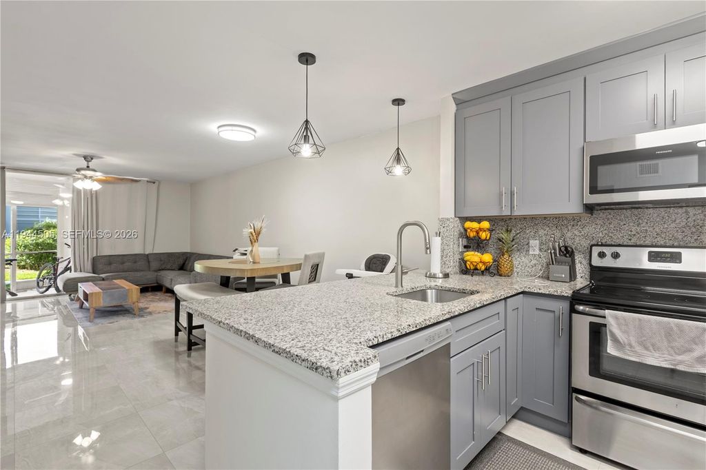 Photo of 400 SE 10th St #103, Deerfield Beach, FL 33441 (MLS # A11944505)