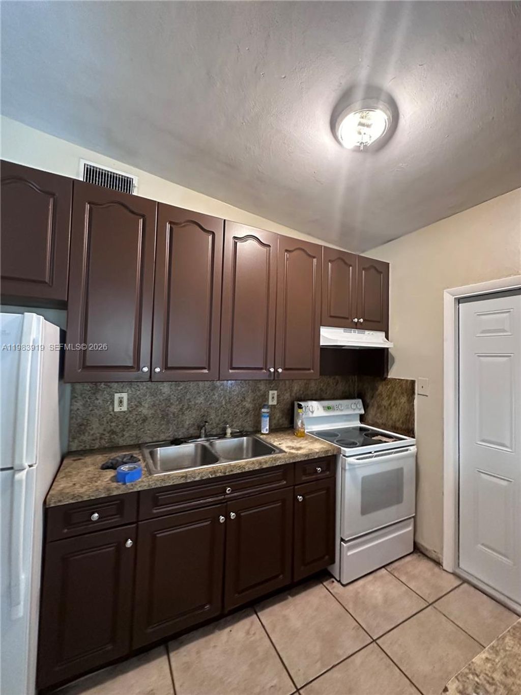 Photo of 320 NW 33rd Ave, Lauderhill, FL 33311 (MLS # A11983919)