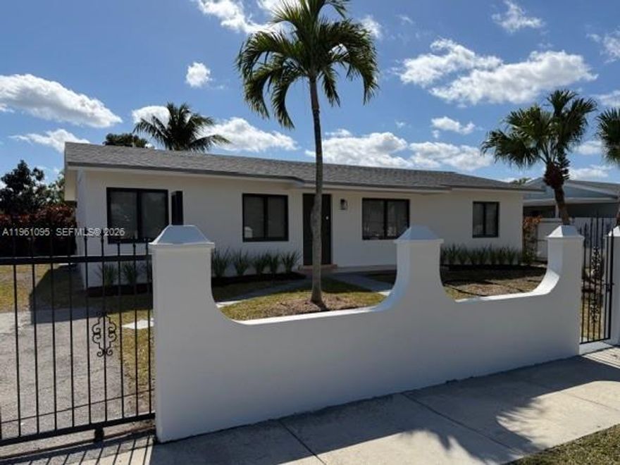 NEW IMPACT WINDOWS AND DOORS, NEW ROOF (DEC 2024), AND UPDATED HOME THROUGHOUT.  VERY SPACIOUS 3/2 WITH SOLID WOOD KITCHEN CABINETS AND QUARTZ COUNTERTOPS - BRAND NEW STAINLESS STEEL APPLIANCES.  ALL FENCED IN YARD WITH DECORATIVE CONCRETE WALL IN FRONT OF PROPERTY AND ROLLING GATE FOR DRIVEWAY - PLENTY OF SPACE TO DRIVE BEYOND DRIVEWAY INTO BACKYARD.  THE PRIVATE BACKYARD FEATURES AN OPEN AIR TERRACE ATTACHED TO HOME FOR ENTERTAINING, AS WELL AS A CONCRETE BLOCK SHED FOR STORAGE, AND ALSO AN ESTABLISHED WELL.  DEFINITELY PLENTY OF ROOM FOR YOUR OWN DREAM POOL.   BEST OF ALL ~  NO  ~  H O A  !!!  COME TAKE A LOOK AND YOU WILL NOT BE DISAPPOINTED.