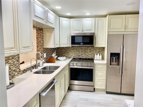 Photo of 619 NE 14th Ave #301, Hallandale Beach, FL 33009 (MLS # A11966669)