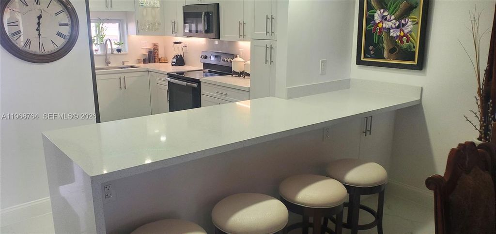 Photo of 9720 S Hollybrook Lake Dr #303, Pembroke Pines, FL 33025 (MLS # A11968764)