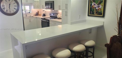 Photo of 9720 S Hollybrook Lake Dr #303, Pembroke Pines, FL 33025 (MLS # A11968764)