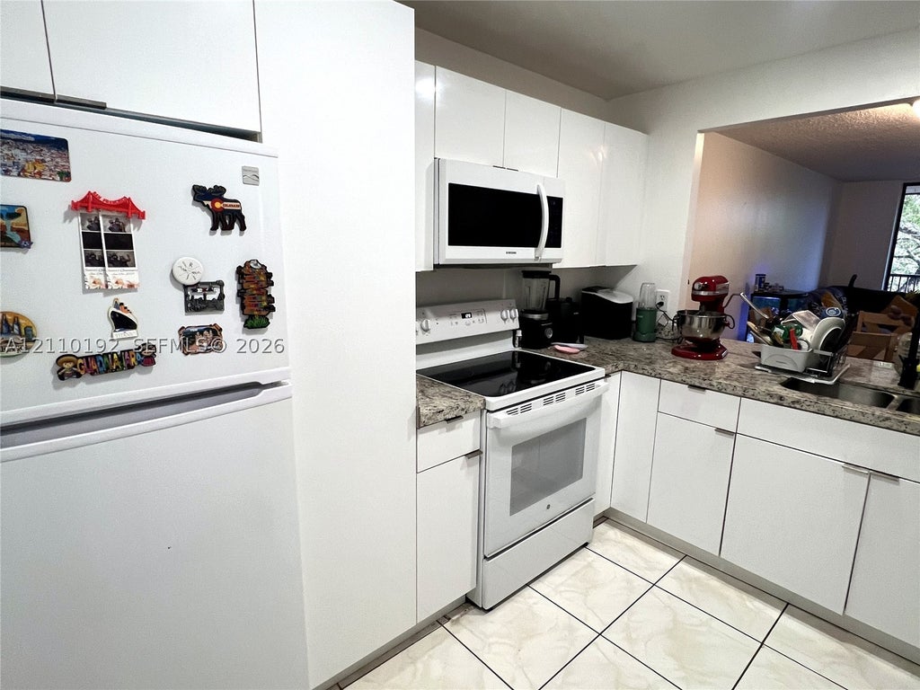 Photo of 100 NW 76th Ave #302-2, Plantation, FL 33324 (MLS # A12110192)