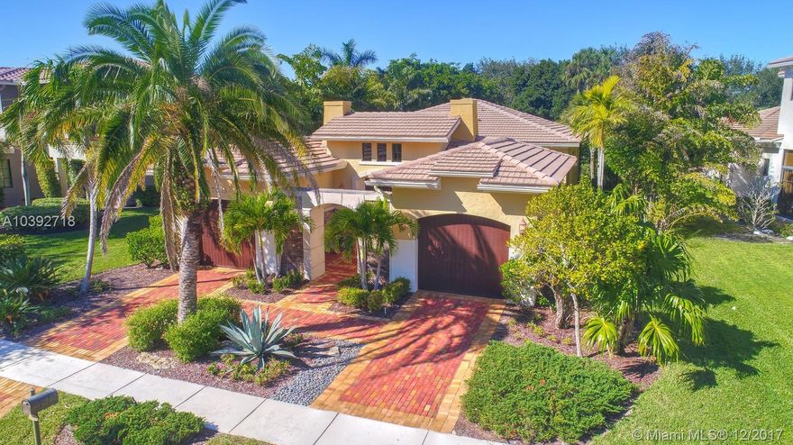 Your opportunity to own this gorgeous home in Parkland Golf & Country Club. Single story, Palermo model located on wide pie shaped lot w/ plenty of room for a pool. This exquisite home features volume ceilings, stunning crown molding, marble floors throughout living area, formal dining room, large open chef's kitchen, spacious great room. Split bedrooms w/ jack-n-jill bath, closet built-ins, Spa-like master suite lined w/ windows. Impressive laundry room. Impact glass. Split two car garage. Dine Al-Fresco in your courtyard or backyard covered patio with private lot, no rear neighbors & tranquil views of the waterfalls. Floor plan & walk-thru video tour available. Amenities include  43,000sqft clubhouse w/ pools,restaurant,gym,spa,tennis,kids activities & more! Golf available-not required.