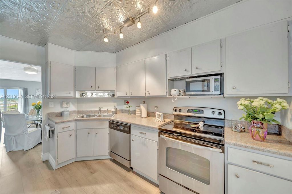 Photo of 3575 Broken Woods Dr #1004, Coral Springs, FL 33065 (MLS # A12019048)