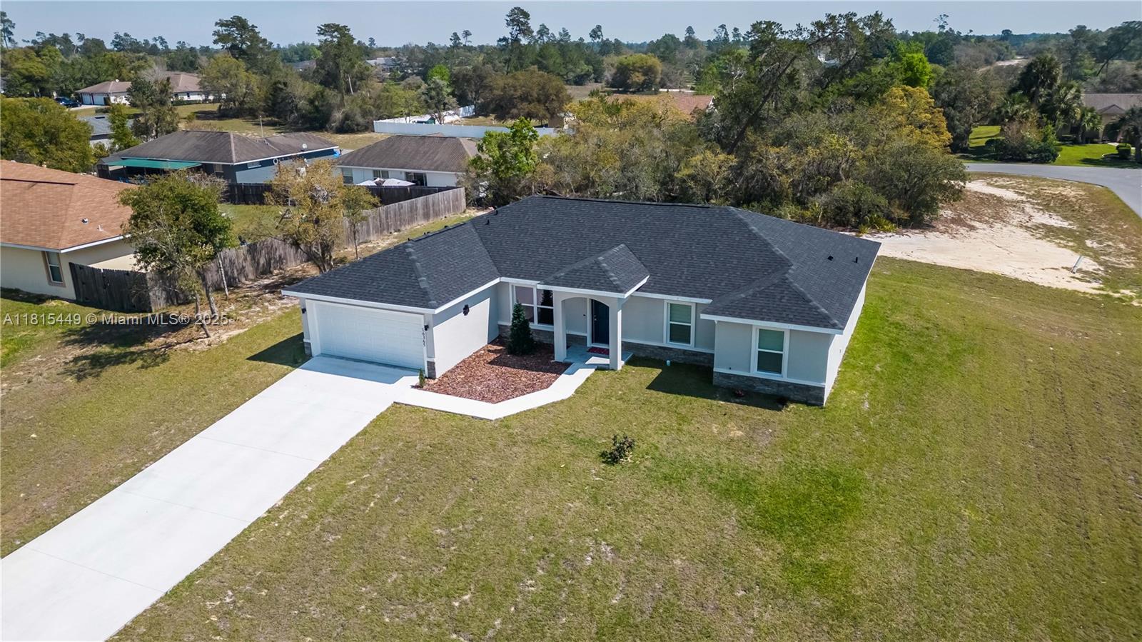 Welcome to your hilltop haven! This stunning 4-bed, 3-bath home in Marion Oaks, Ocala, offers modern elegance and scenic charm. Crafted in 2022, it features granite countertops, stainless steel appliances, and a wine cooler. The master suite, separated by a chic barn door, provides a serene retreat. With a spacious layout, Jack & Jill bathroom, and seamless indoor/outdoor flow, it's perfect for entertaining. Explore nearby attractions like Gypsy Gold Farm and Silver Springs. Owners are relocating for work, so seize this exceptional opportunity. Nearby schools include Sunrise Elementary and Dunnellon High School. Don't miss out on this captivating property! The bedrooms floors have been updated from carpet to vinyl planks.