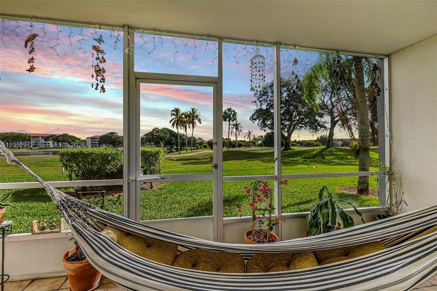 First-floor Corner 2BD/2BA unit featuring laminate wood flooring throughout and a screened porch with peaceful views of the golf course, lagoon, and lush green areas. Spacious bedrooms and an in-unit washer and dryer—a huge plus—add everyday convenience. Enjoy one assigned parking space directly in front of the unit along with ample guest parking. Located in Century Village, a sought-after 55+ resort-style community offering 24/7 gated security, 23 pools, clubhouse, theater, state-of-the-art fitness center, on-site medical services, tennis courts, shuffleboard, trolley and bus transportation, and an 18-hole championship golf course right in your backyard. Experience comfort, convenience, and an active lifestyle all in one place.