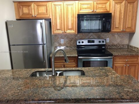 Photo of 1233 SW 46th Ave #603, Pompano Beach, FL 33069 (MLS # A11884926)