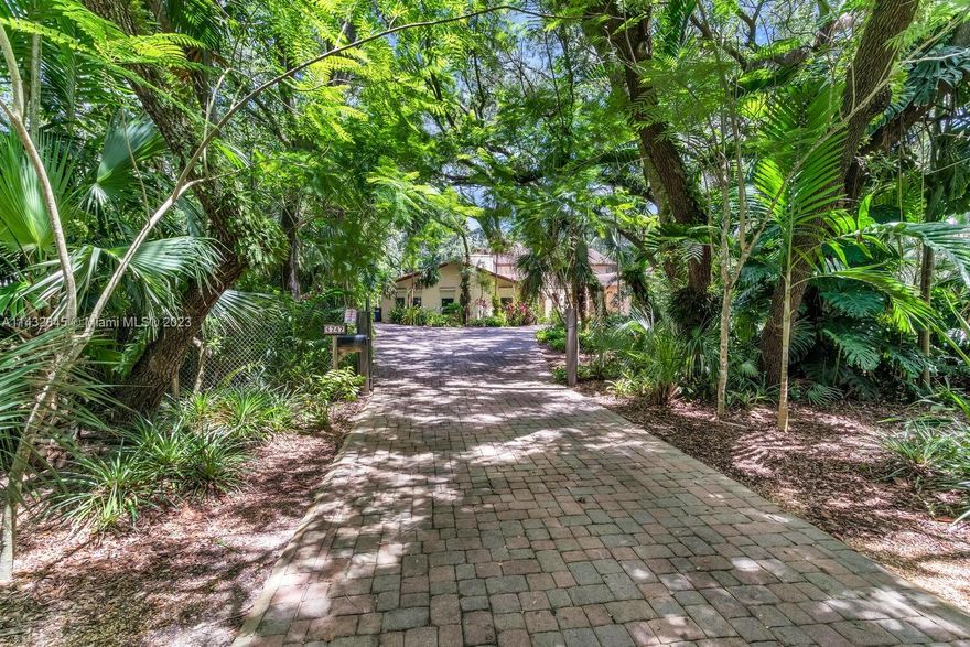 Welcome to a mini "Fairchild Garden"/ Stunning almost one acre lot filled with native plantings, majestic oaks and exotic foliage. Custom built in 1970 by original owner with an addition by Jennings Construction in 1978 connected by charming courtyard. Gorgeous screened in pool, 2-car garage. The property is ready for a redo or build to suit.