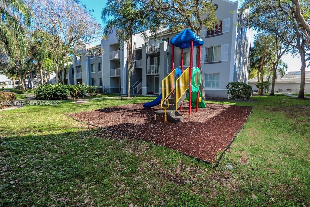 Photo of 11133 SW 8th St #102, Pembroke Pines, FL 33025 (MLS # A12015337)