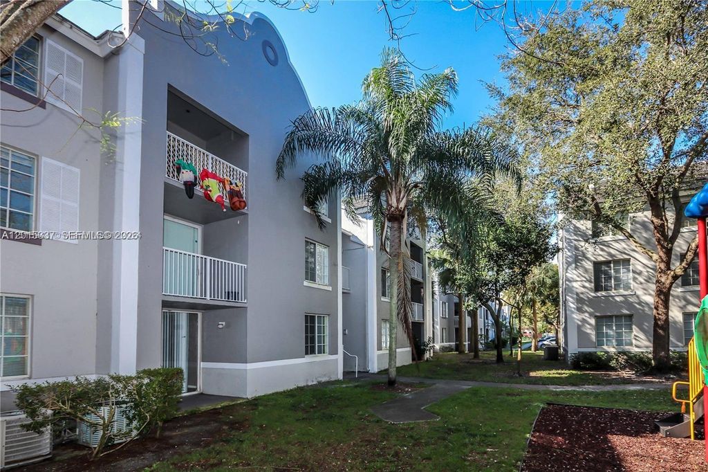 Photo of 11133 SW 8th St #102, Pembroke Pines, FL 33025 (MLS # A12015337)